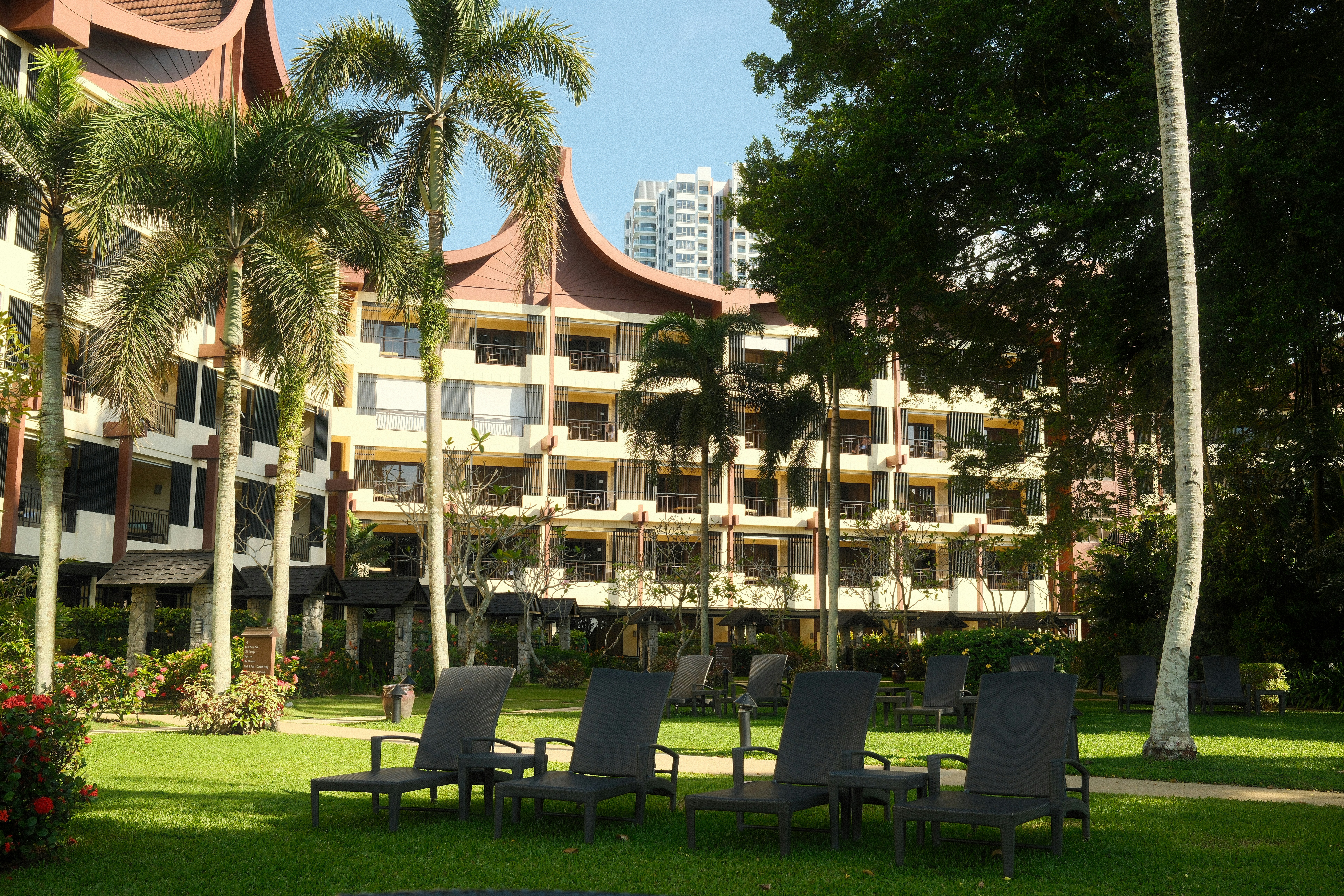 large hotel with palm trees